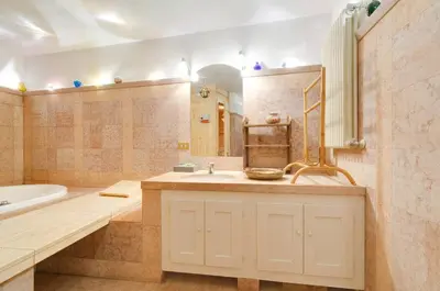 a bathroom with a tub and a sink and a bath tub at Chalet Monciòn in Rualp