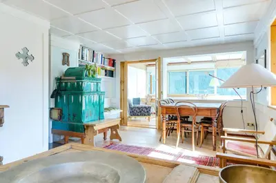a living room with a table and a dining room at Chalet Monciòn in Rualp