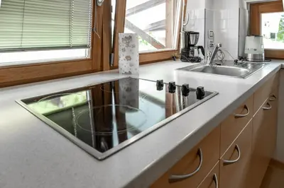 a kitchen with a sink and a counter top at Öboluckna Appartment in Molini di Tures