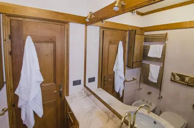 a bathroom with a tub and a sink at Comfort loft, appartamento centrale con giardino in Cortina dʼAmpezzo