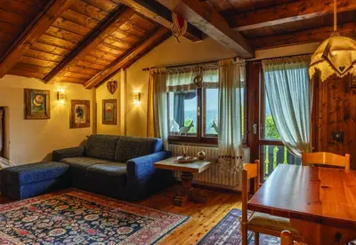 a living room with a couch and a table at Casa Mary in San Vito di Cadore