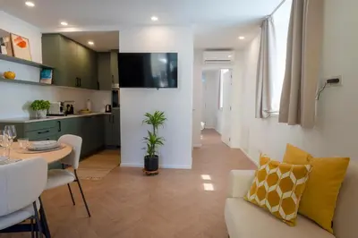 a living room with a couch and a table at Apartment Merano Mitte in Merano