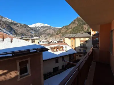 a view of the mountains from the balcony of a building at casa Daria in Predazzo