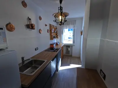 a kitchen with a sink and a counter top at casa Daria in Predazzo