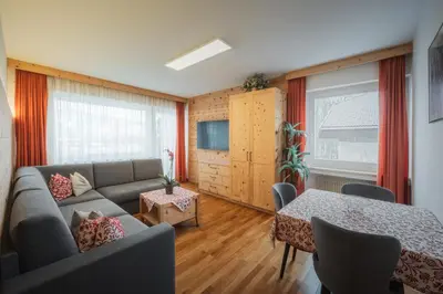 a living room with a couch and a table at Haus Petra Mutschlechner in Riscone