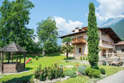 a house with a garden and a gazebo at Ansitz Mair im Korn in Lagundo