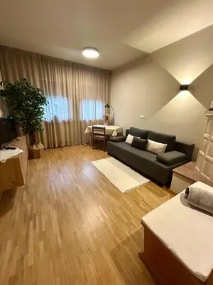 a living room with a couch and a table at Apartment Martha in Sankt Leonhard in San Leonardo in Passiria