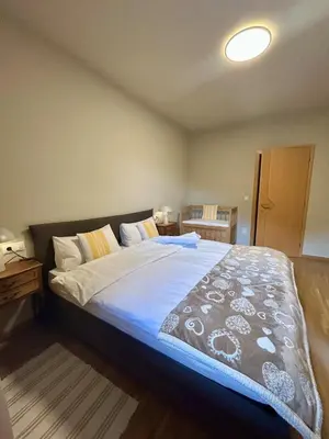a bedroom with a large bed in a room at Apartment Martha in Sankt Leonhard in San Leonardo in Passiria