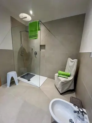 a bathroom with a shower and a sink and a tub at Apartment Martha in Sankt Leonhard in San Leonardo in Passiria