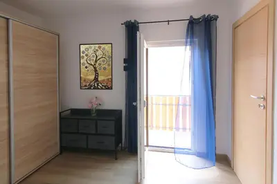 a door leading to a room with a mirror at Casa Virginia in Val di Fiemme in Castello di Fiemme