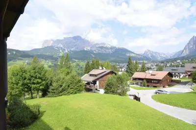 a view of a village with mountains in the background at Crepedel in Cortina dʼAmpezzo
