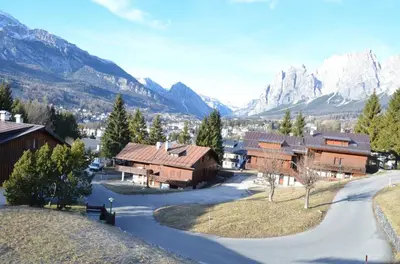 arial view of a village with mountains in the background at Crepedel in Cortina dʼAmpezzo