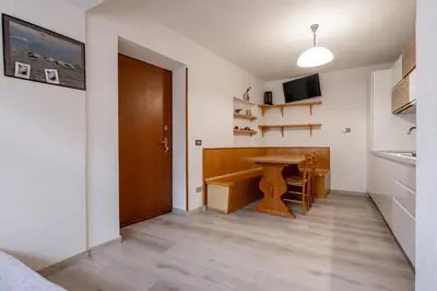 a small kitchen with a table in a room at Casa Quinta by Go New Location in Predazzo