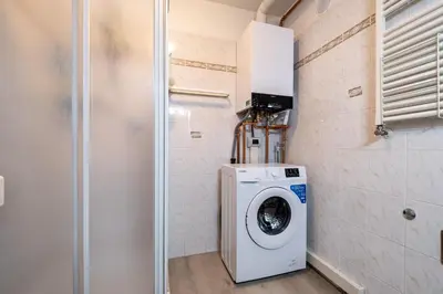 a laundry room with a washer and dryer at Casa Quinta by Go New Location in Predazzo