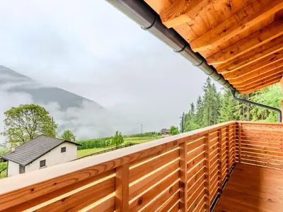a balcony with a view of a house at Villa Casa del Larice by Interhome in Livo
