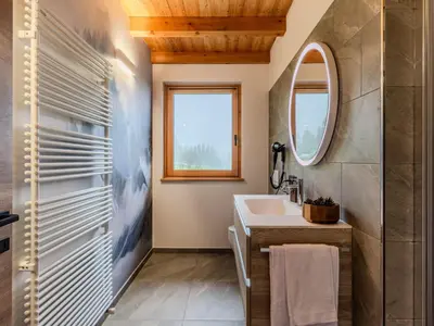 a bathroom with a sink and a mirror at Villa Casa del Larice by Interhome in Livo