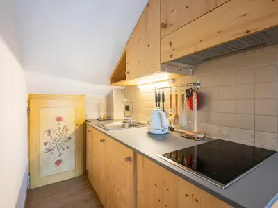 a kitchen with a sink and a counter top at Apartment Casa Morelli by Interhome in Pozza di Fassa