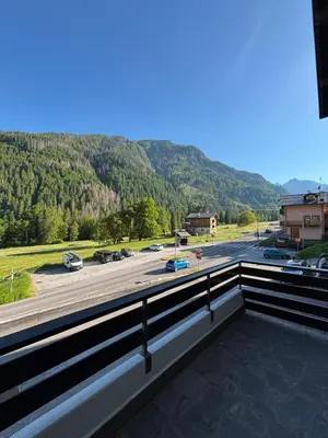 a balcony with a view of a parking lot at Il Cirmolo in Canale dʼAgordo