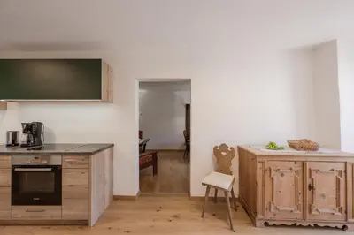 a kitchen with a sink and a counter top at Stammhaus Vetterer in Lana