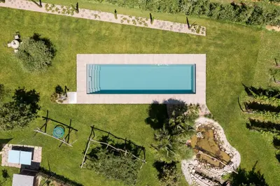 an overhead view of a swimming pool in a yard at Stammhaus Vetterer in Lana