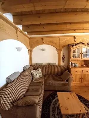 a living room with a couch and a table at Beautiful apartment in Zoldo Alto Dolomites in Pianaz