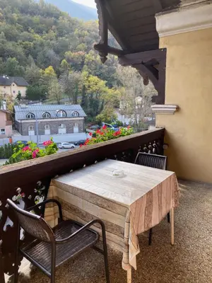 a table and chairs on a balcony with a view at Vintage Castle 
