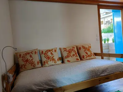 a bed in a room with pillows on it at La Casetta in San Vito di Cadore