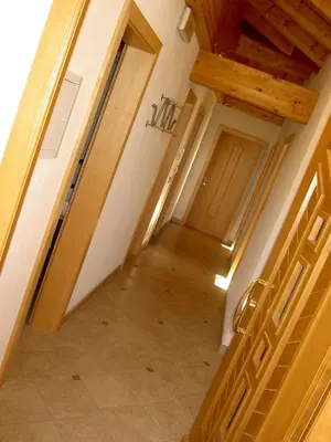 an overhead view of a hallway with wooden doors at Apartment Oberhauserhof in Falzes