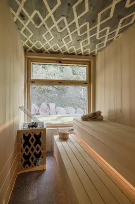 a room with a window and a wooden wall at Hochegg Hideaway in Laives