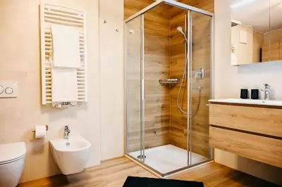 a bathroom with a shower and a sink at Suite by Silvy in Vipiteno