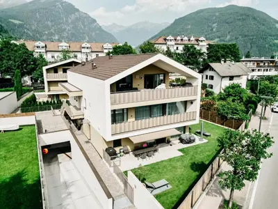 an aerial view of a house with mountains in the background at Suite by Silvy in Vipiteno