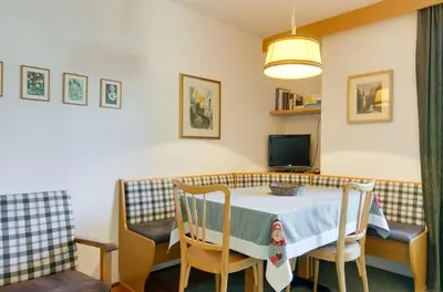 a dining room with a table and chairs at Apartment Laura in Ortisei