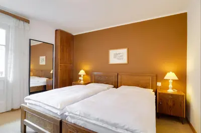 a bedroom with a large bed and a large mirror at Apartment Laura in Ortisei