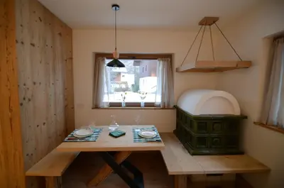 a dining room with a table and a window at Villa Primavera in Alvera