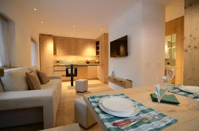 a living room with a couch and a table at Villa Primavera in Alvera