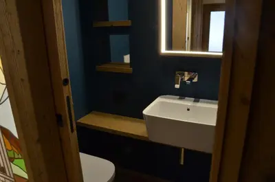 a bathroom with a white sink and a mirror at Villa Primavera in Alvera