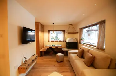 a living room with a couch and a table at Villa Primavera in Alvera