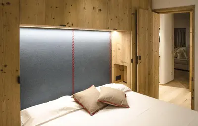 a bed in a room with a wall at Villa Primavera in Alvera