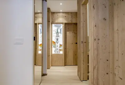 an open hallway with wooden walls and wooden floors at Villa Primavera in Alvera