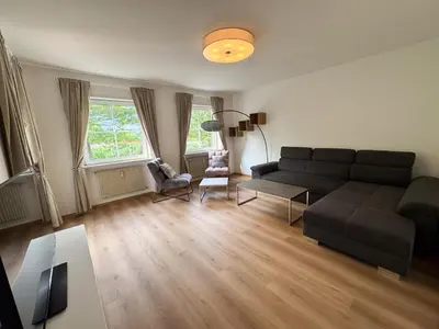 a living room with a couch and a table at Apartment Annabell - Alpstay in Naturno