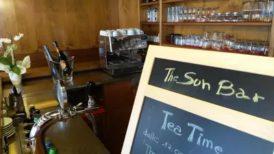 a bar with a sign that says the soft bar at Albergo al Sole in Val di Zoldo