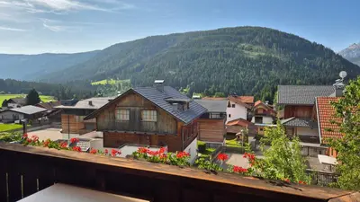 a view of a town with a mountain at Appartements Oberhammer in Tesido