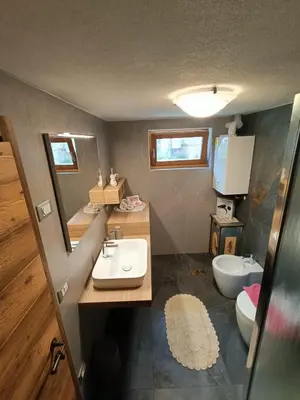 a bathroom with a sink and a toilet at Casa Soraya 2 in Falcade