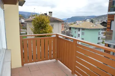 a balcony with a view of a city at Appartamenti Donatella in Cavalese