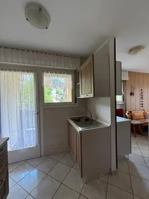 a kitchen with a sink and a counter top at Appartamenti Donatella in Cavalese