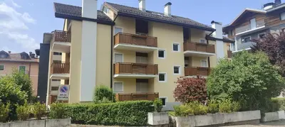 an apartment building with balconies on the side of it at Appartamenti Donatella in Cavalese