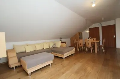 a living room with a couch and a table at Ferienwohnung Pirchner in San Lorenzo di Sebato