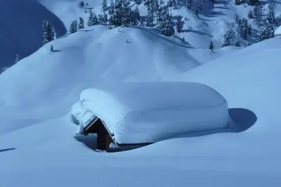 a pile of snow on top of a house at Ferienwohnung Pirchner in San Lorenzo di Sebato
