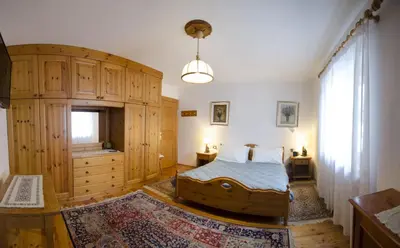 a bedroom with a large bed and a large window at Villetta Chiave in Chiave