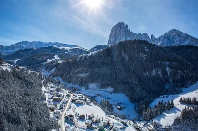 an aerial view of a ski resort in the mountains at Pension Grohmann in Santa Cristina in Val Gardena